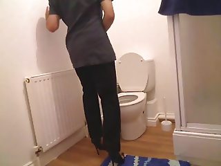 Chambermaid in her bathroom wearing high heels very horny